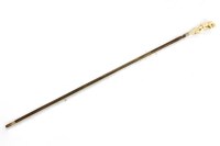 Lot 500 - A carved ivory handled walking cane