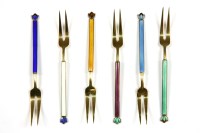 Lot 305 - A cased set of six silver and coloured enamel handled pickle forks