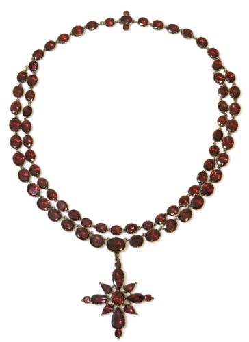 Lot 278 - A late 18th century two row garnet set rivière with a garnet set cruciform pendant