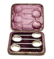 Lot 116 - A set of four silver apostle terminal serving spoons