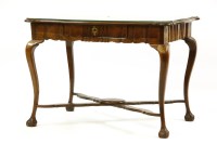Lot 559 - A walnut centre table