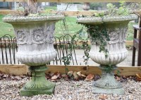 Lot 574 - A pair of reconstituted campagna urns