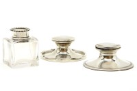 Lot 97 - An Edwardian silver capstan inkwell