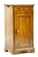 Lot 419 - A walnut and marble topped bedside cabinet