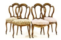 Lot 425 - A set of four walnut chairs