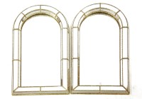 Lot 532 - A pair of arch form wall mirrors