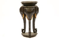 Lot 567 - An Indian ebonised stand