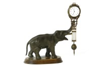 Lot 451 - A spelter mystery clock
