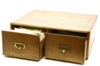 Lot 370 - An oak two drawer chest containing a large quantity of mixed postcards