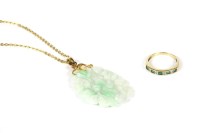 Lot 121 - A carved jade pendant