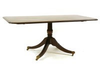 Lot 561 - A Georgian and later mahogany single pedestal dining table