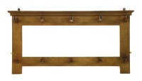 Lot 51 - An Arts and Crafts oak hanging coat rack