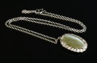 Lot 32 - A quartz cat's eye and diamond cluster pendant