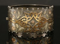 Lot 122 - A late Victorian sterling silver hinged bangle