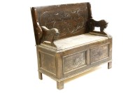 Lot 363 - A 20th century carved oak monks bench
