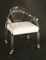 Lot 648 - A lucite desk chair