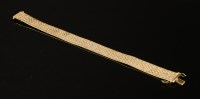 Lot 364 - An 18ct three colour gold brick link bracelet