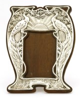 Lot 105 - A silver embossed 'Peacock' photograph frame