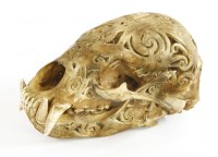 Lot 273 - A CARVED BEAR SKULL