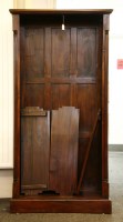 Lot 433 - A mahogany floor standing open bookcase with adjustable shelves flanked by reeded pilasters on turned feet