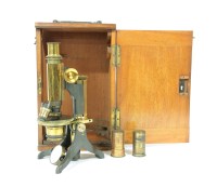 Lot 188 - A mahogany and brass microscope