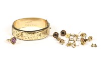Lot 63 - A 9ct gold mixed oval cut amethyst ring