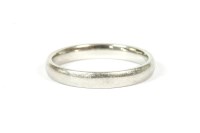 Lot 83 - A platinum court shaped wedding ring