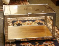 Lot 538 - A chrome and glass trolley