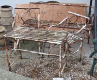 Lot 603 - A late 19th century wrought iron garden suite