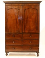 Lot 377 - An early 19th century mahogany linen press