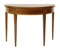 Lot 446 - An Edwardian Sheraton style mahogany demi-lune fold over table
