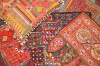 Lot 245 - A collection of woven rugs and wall hangings
