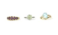 Lot 18 - An 18ct gold five stone graduated oval cut amethyst ring