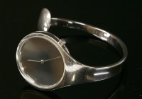 Lot 262 - A ladies stainless steel Georg Jensen quartz Vivianna Torun bangle watch