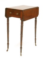 Lot 522 - A George III strung and crossbanded worktable