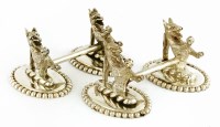 Lot 19 - A near pair of electroplated knife rests