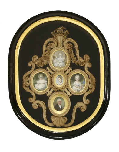 Lot 646 - An elaborately moulded and cut leather openwork frame laid on blue plush