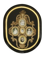 Lot 646 - An elaborately moulded and cut leather openwork frame laid on blue plush