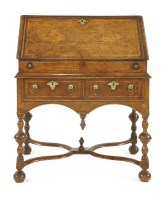 Lot 564 - A Queen Anne strung and inlaid oak bureau on stand