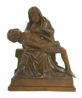 Lot 587 - A carved oak pieta