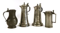 Lot 546 - Two pewter lidded jugs