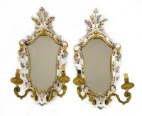Lot 922 - A pair of Italian faience pottery girandoles