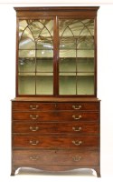 Lot 390 - A George III mahogany secretaire bookcase