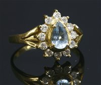 Lot 280 - An aquamarine and diamond gold cluster ring