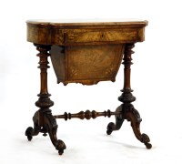 Lot 429 - A figured walnut games worktable