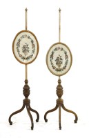 Lot 396 - A pair of mahogany pole screens