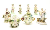 Lot 121 - Four porcelain cherub figures (one Samson