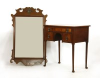 Lot 385 - Small walnut three drawer lowboy standing on tapering legs and pad feet