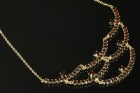 Lot 28 - A French silver gilt garnet set swag centrepiece necklace