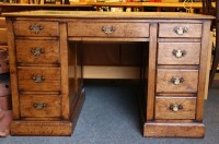 Lot 355 - An oak pedestal desk